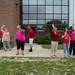Willow Run faculty members wave to students as their buses leave, Friday June 7.
Courtney Sacco I AnnArbor.com  